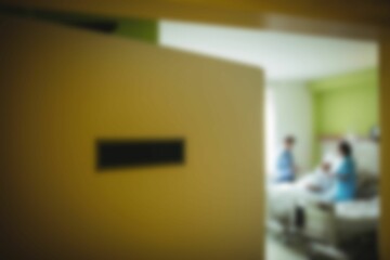 Doctor taking care of patient in hospital room