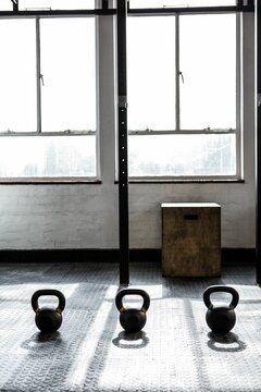Fototapeta Image of dumbbells on floor at gym