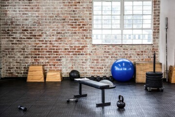 Image of sport equipement on floor at gym