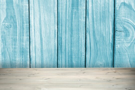 Fototapeta Flat design is showing weathered blue wooden plank wall and light-gray tabletop surface