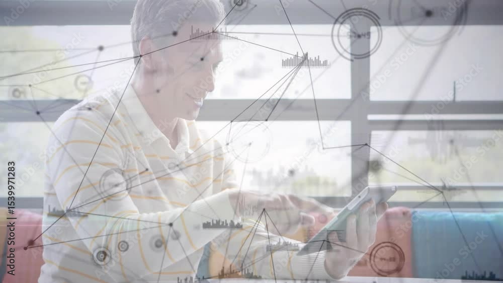 Poster businessman lifting tablet on sofa tapping screen causing nodes and data charts forming by finger