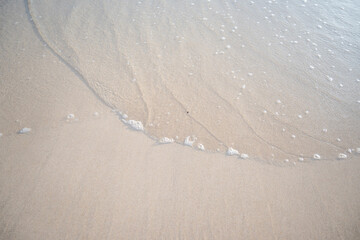 landscape view of beautiful tropical sand beach and sea in sunny day. Beach sea space area, soft focus