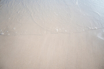 landscape view of beautiful tropical sand beach and sea in sunny day. Beach sea space area, soft focus