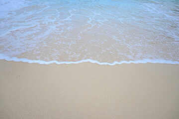 landscape view of beautiful tropical sand beach and sea in sunny day. Beach sea space area, soft focus