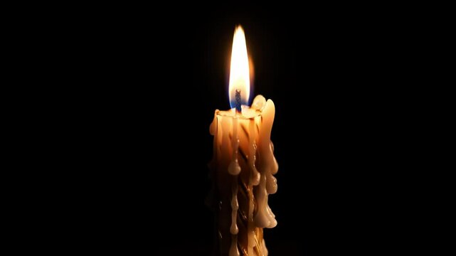 Single candle with dripping wax