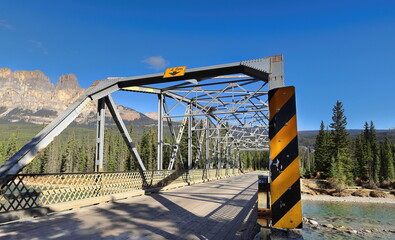 Metal, 9 panel, fixed bridge from 1950 on the Windermere Highway spanning the emerald-green Bow River next to Castle Junction. Banff NP-AB-Canada-373