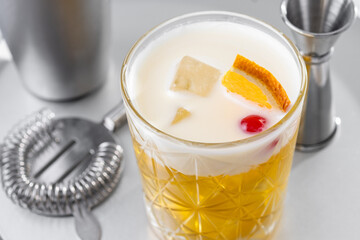 Classic cocktail whiskey sour on white marble background