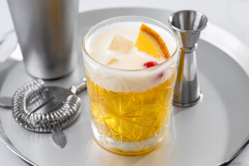 Classic cocktail whiskey sour on white marble background
