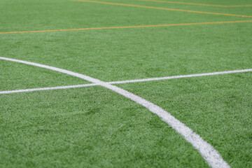 Obraz premium Bright green artificial turf field waits for the next exciting game