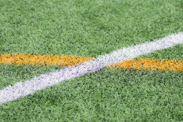 Vibrant soccer field marked by intersecting lines in bright colors