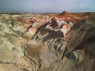 Vibrant colors of Aktumsuk hills at dawn in Karakalpakstan, Uzbekistan