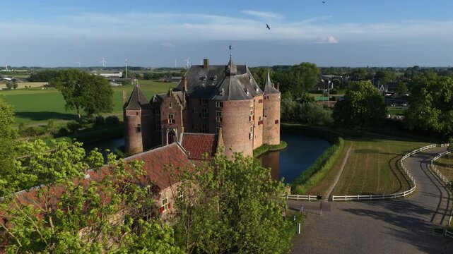 Ammersoyen Castle is a castle in Ammerzoden. Monument, histroic building, tower, walls, aerial video, building exterior.