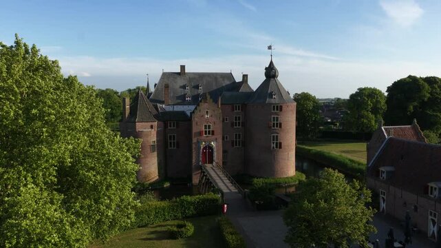 Ammersoyen Castle is a castle in Ammerzoden. Monument, histroic building, tower, walls, aerial video, building exterior.