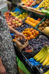 Plum Purchase at Fruit Market