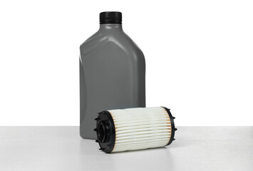 Motor oil in plastic bottle and filter isolated on white