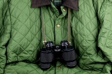 Binoculars Hanging on a Quilted Outdoor Country Coat