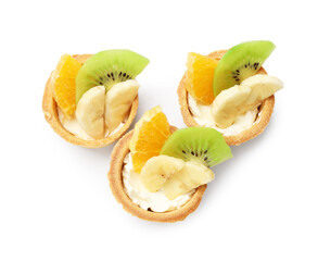 Tartlets with fruits isolated on white, top view. Delicious dessert