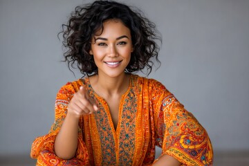 Smiling young woman pointing finger and choosing you