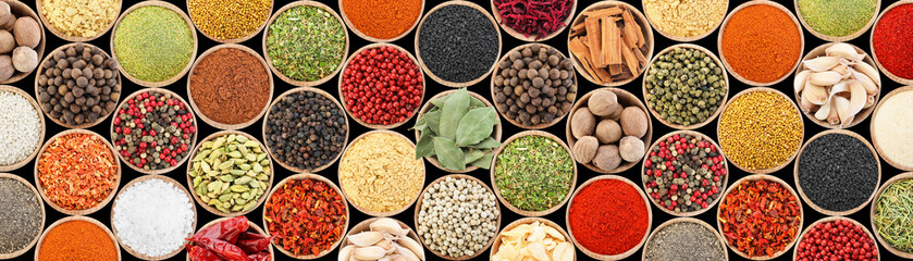 Set of different aromatic spices in bowls on black background, flat lay. Banner design