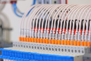 Marking electrical wiring wires with thermally printed nylon tape. 