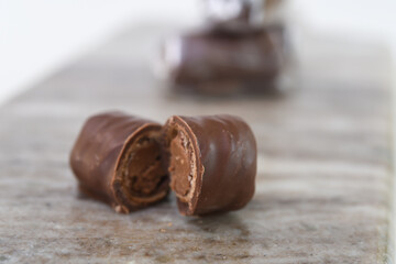 Decadent Chocolate Filled Wafer Rolls on Marble reveal a creamy chocolate filling within the crisp wafer side view of sweet snack