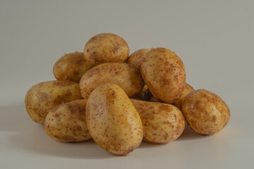 raw potatoes on a wooden table