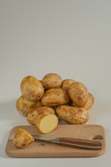 potatoes on a wooden board