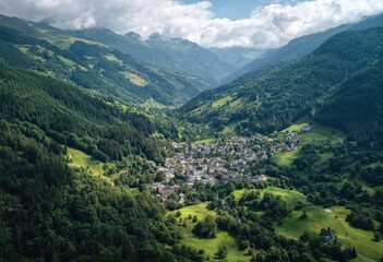 Fototapeta premium Lush green valley nestled between towering mountains, a small village sits serenely in the valley floor, under a partly cloudy sky
