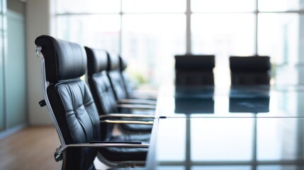 Modern conference room with sleek black leather chairs, shiny glass table, metallic armrests, cushioned backs, large grid-patterned windows, natural light, and professional business atmosphere.