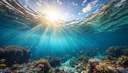 Sunlight rays underwater with tropical coral reef and clear ocean

