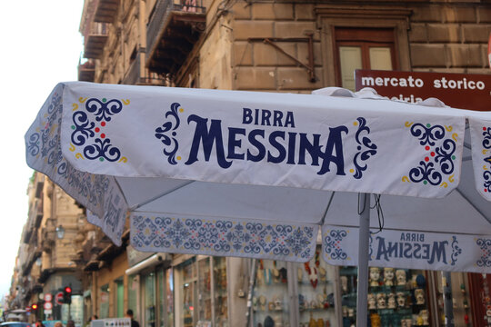 Palermo, Italy, May 10, 2025, Birra Messina logo parasol in the city of Palermo