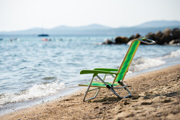 Empty beach chair inviting relaxation by the sea