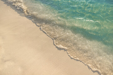 Tranquil wallpaper closeup tropical wave splash on soft sand sunny ocean ripples, vibrant sea water texture, peaceful beach scene, summer coastal landscape perfect for travel, relaxation nature decor