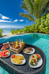 Relaxing tropical vacation scene floating breakfast private pool luxury beach resort. Leisure...
