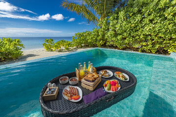 Relaxing tropical vacation scene floating breakfast private pool luxury beach resort. Leisure holiday sun chairs umbrella sunny palm trees amazing ocean view. Amazing exotic travel tourism background