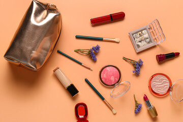 Stylish cosmetic bag with makeup products and beautiful flowers on beige background