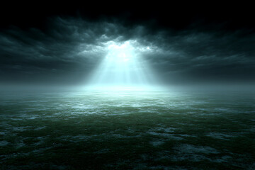 Dark moody landscape with light beam breaking through storm clouds