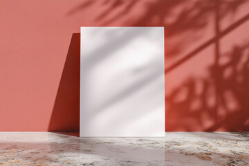A white A1 size poster mockup on a on a raw concrete background with soft shadows. red background