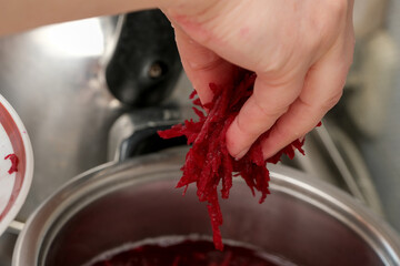 Shredding fresh beets for a vibrant culinary creation
