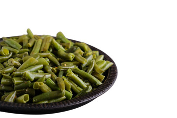 Frying green beans with spices on white background. Copy space