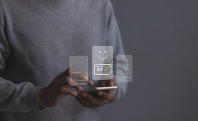 Review Customer, Young Man hand using smartphone mobile with five star to review and give 5 stars with very good results in service, Good review 5 star rating choice feedback