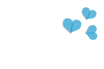 Light blue heart shaped paper on transparent background. Composition of collage with rough texture of paper. Scalloped edges. Love and romance. Lovely halftone color.