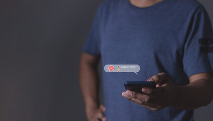 Consumer Satisfaction, Young man with smartphone hand holding to review and gives 1 star, with poor service results, Bad review Rated just 1 star Feedback options