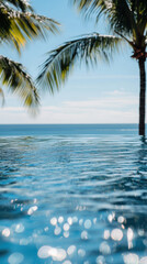Tranquil ocean view with palm trees and sparkling water reflections