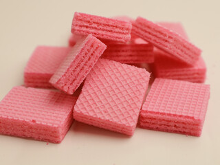 Pink strawberry wafer on white background