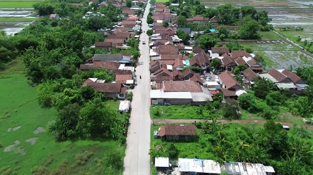 Aerial view of rural area with roads, rice fields and rivers in 4K