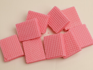 Pink strawberry wafer on white background