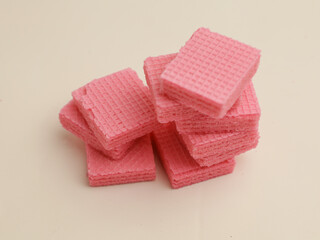 Pink strawberry wafer on white background