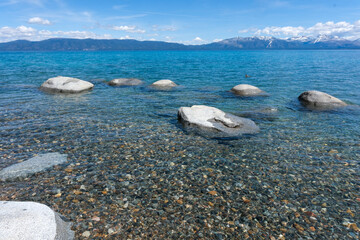 Sugar Pine Point Beach on Lake Tahoe with its beach, pine trees, and beautiful clear water.