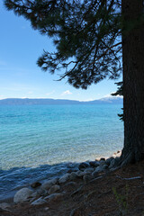 Sugar Pine Point Beach on Lake Tahoe with its beach, pine trees, and beautiful clear water.